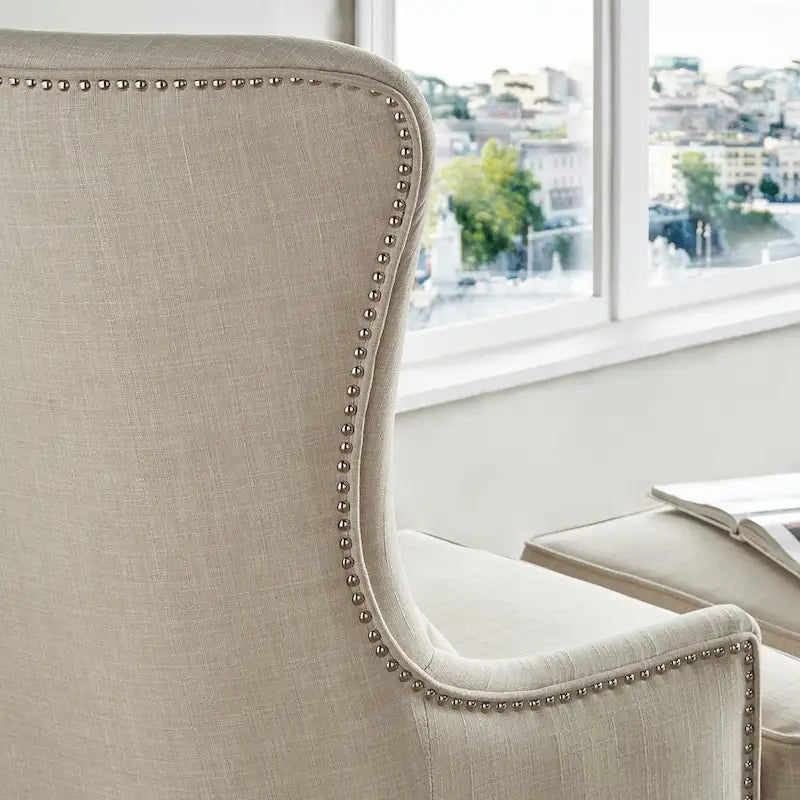 Poltrona lounge Capella Highback Wing con poggiapiedi di